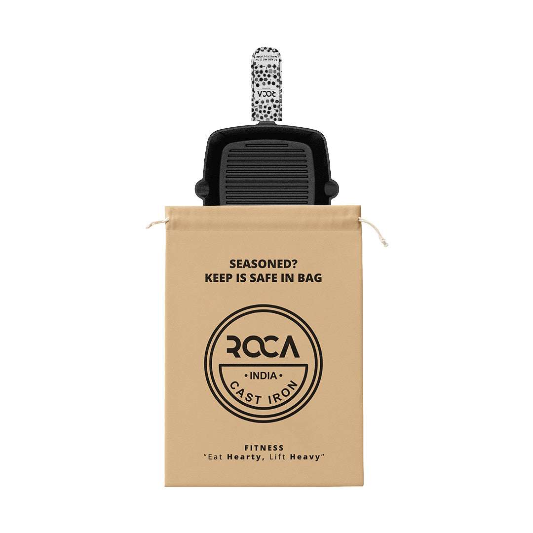 Roca Nix square cast iron grill pan with a patterned handle sleeve and a branded cotton storage bag.