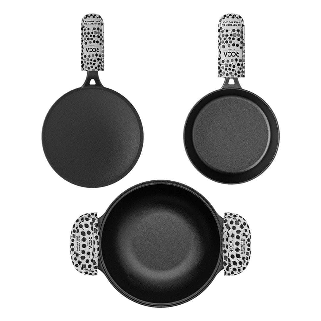 Set of three black frying pans with polka dot handles on a white background