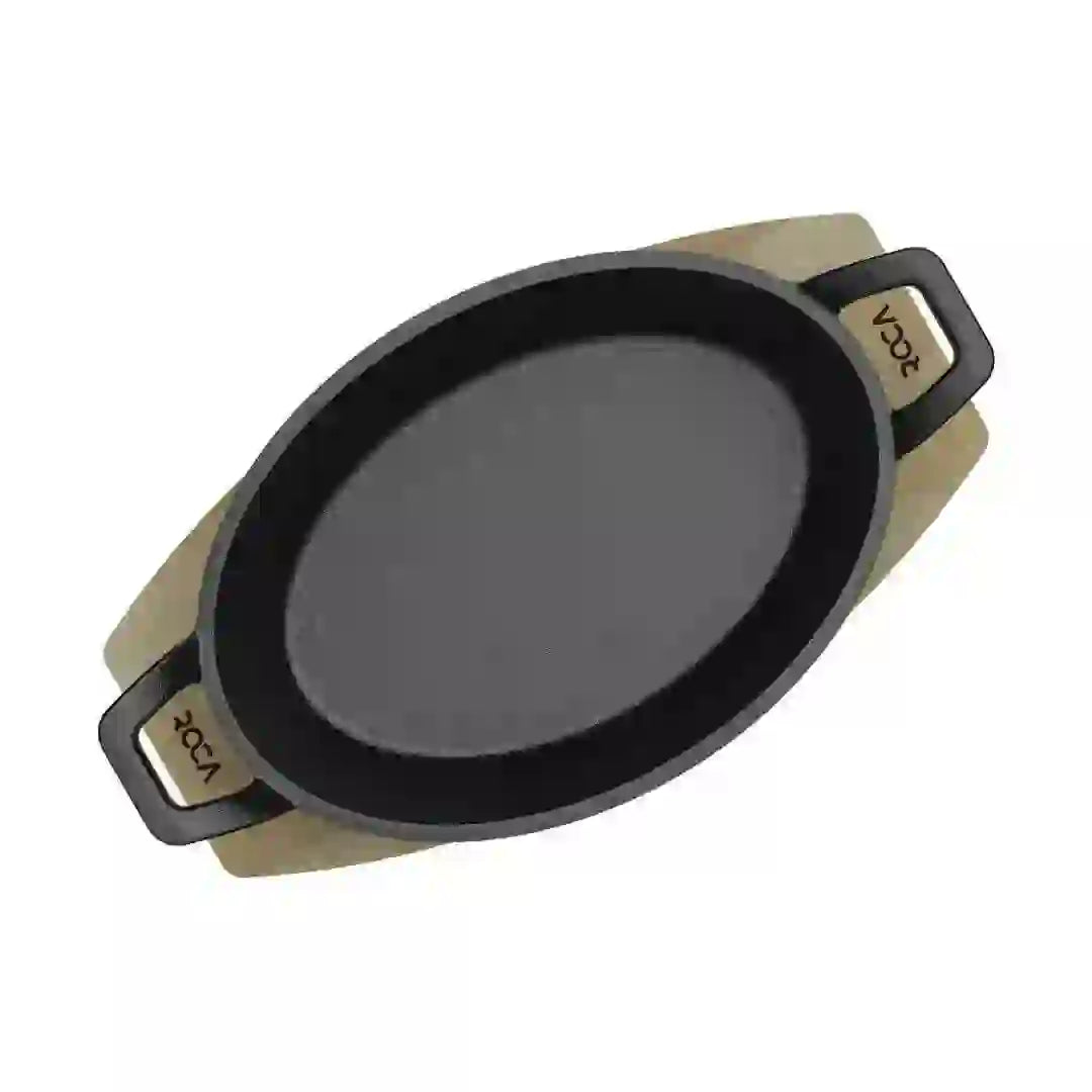 Roca Atlas 20.5 cm cast iron oval pan with two handles resting on a light-colored wooden tray.