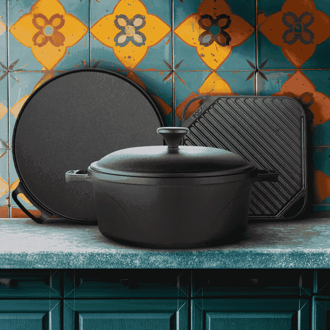 Roca cast iron set with a 24cm Dutch oven, 30cm dosa tawa, and 25cm grill plate on a countertop.