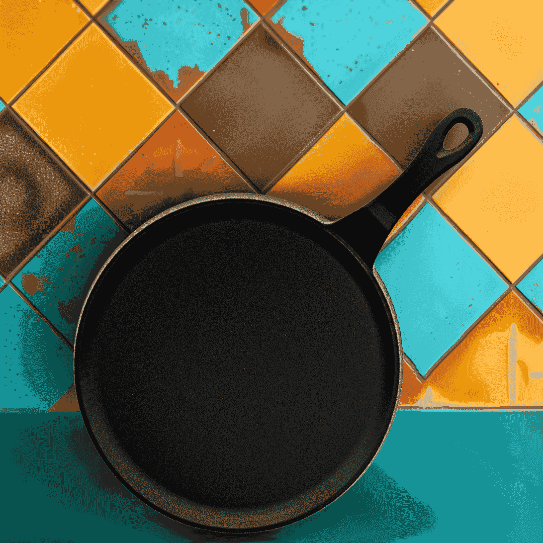 Roca Nix 24cm pre-seasoned cast iron dosa tawa with handle on a colorful tiled background.
