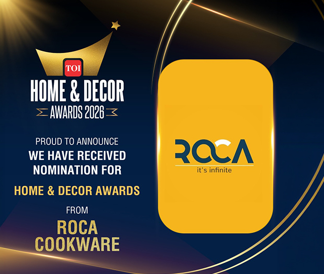 Promotional graphic for the TOI Home & Decor Awards 2020, announcing nomination from Roca Cookware. The design features a dark navy blue background with gold light rays, a gold crown logo for TOI, and a large yellow rounded rectangle displaying the Roca logo.