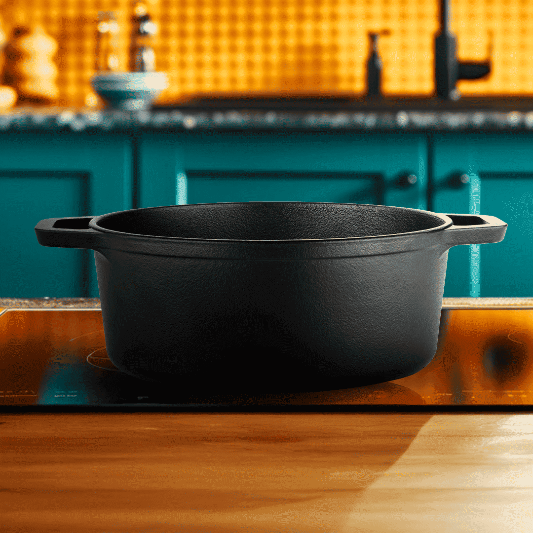 Black cast iron pot on a stove with a kitchen background