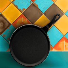Black cast iron skillet on a colorful tiled surface