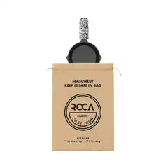 Roca 15cm cast iron skillet with a patterned handle sleeve and a branded cotton storage bag.