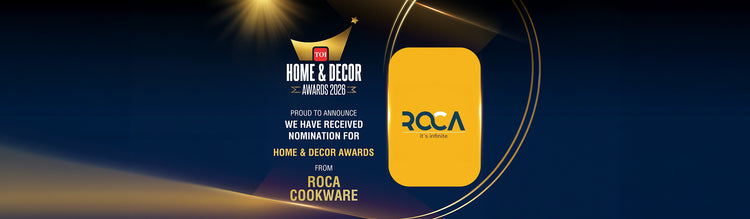 Promotional graphic for the Roca Home & Decor Awards 2023, featuring a yellow Roca logo badge on a dark blue background with gold light effects and text stating 'Home & Decor Awards 2023' and 'Roca Cookware'.